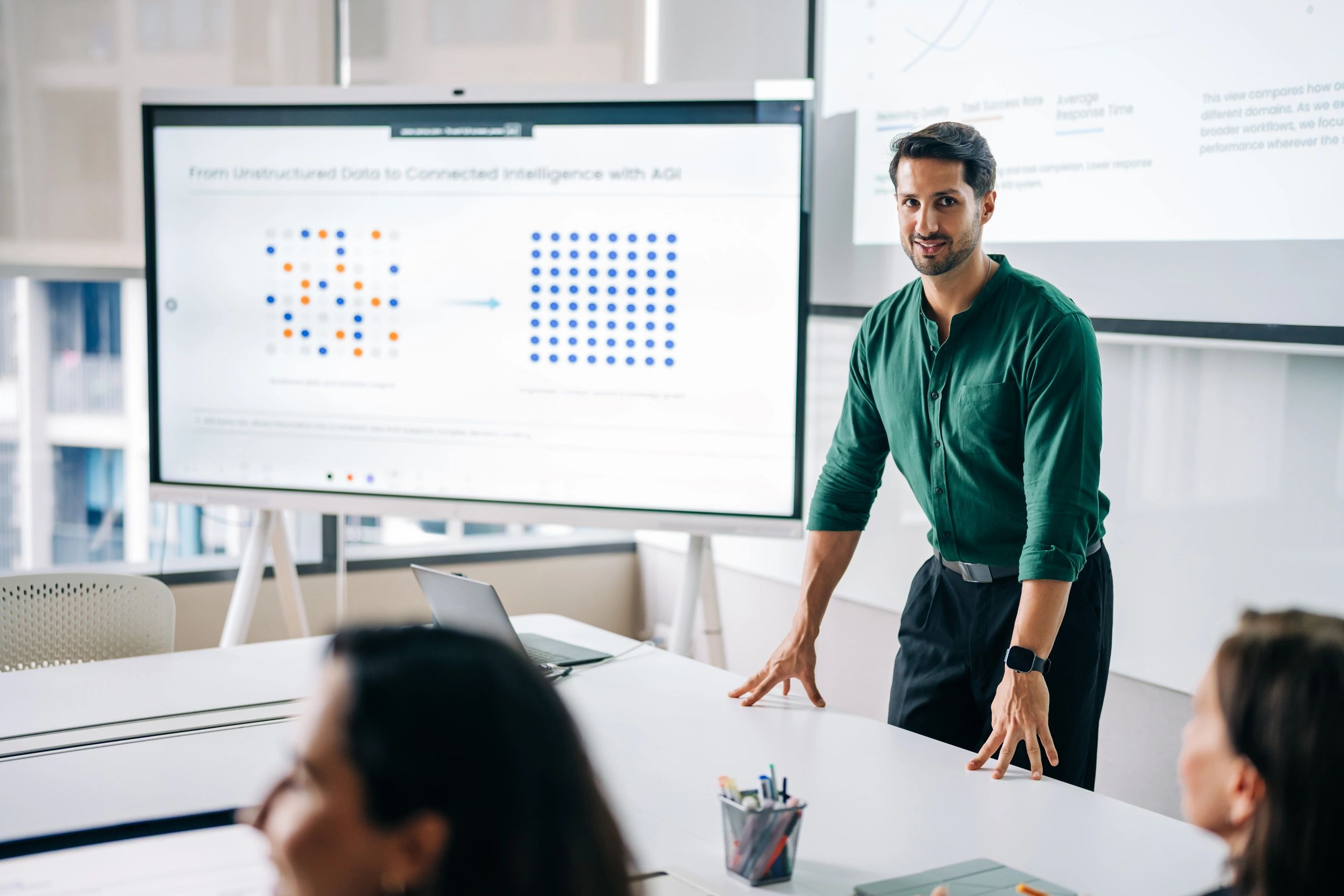 Executive presenting performance metrics in a meeting